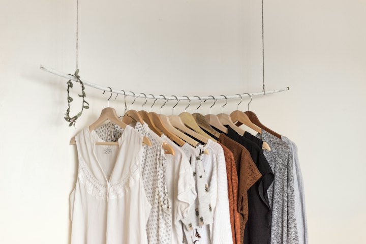 Fabric garments in natural tones on a rail